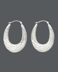 A lady can never go wrong with a classic pair of hoop earrings, especially when they have a twist. Made of 14k white gold, these hoops have an oval shape and feature a graduated twist hoop design. Approximate drop: 1-1/4 inches. Approximate width: 3/4 inch. A lady can never go wrong with a classic pair of hoop earrings, especially when they have a twist. Made of 14k white gold, these hoops have an oval shape and feature a graduated twist hoop design. Approximate drop: 1-1/4 inches. Approximate width: 3/4 inch.