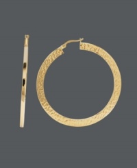 Nothing says classic and cool like the perfect pair of hoops. This trendy style features a unique hammered design on a flat surface. Crafted in 14k gold. Approximate diameter: 1-9/10 inches.