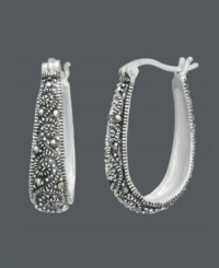 Free-spirited style with bohemian savvy. Genevieve & Grace hoop earrings feature glittering marcasite scrolls set in sterling silver. Approximate diameter: 15/16 inch. Free-spirited style with bohemian savvy. Genevieve & Grace hoop earrings feature glittering marcasite scrolls set in sterling silver. Approximate diameter: 15/16 inch.