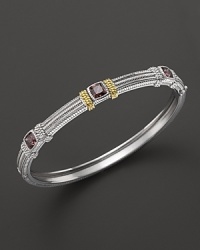 Detailed in 18K yellow gold, Judith Ripka's sterling silver and raspberry crystal bangle lends a timelessly luxe look. Detailed in 18K yellow gold, Judith Ripka's sterling silver and raspberry crystal bangle lends a timelessly luxe look.