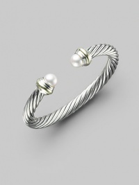 From the Cable Classics Collection. A signature Yurman cable of sterling silver, with lustrous white freshwater pearl end caps banded in 14k gold. White freshwater pearls Sterling silver and 14k yellow gold Cable, 7mm Diameter, about 2¼ Imported From the Cable Classics Collection. A signature Yurman cable of sterling silver, with lustrous white freshwater pearl end caps banded in 14k gold. White freshwater pearls Sterling silver and 14k yellow gold Cable, 7mm Diameter, about 2¼ Imported