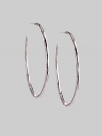 Delicate yet dramatic hoops of hammered sterling silver. Sterling silver Diameter, about 1¾ Post back Imported Delicate yet dramatic hoops of hammered sterling silver. Sterling silver Diameter, about 1¾ Post back Imported