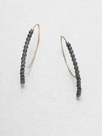 Elegantly simple arc-shaped hoops are strung with faceted beads of blackened sterling silver, capped with tiny beads of 14k gold.14k yellow gold and oxidized sterling silverLength, about 1.25PiercedMade in USA Elegantly simple arc-shaped hoops are strung with faceted beads of blackened sterling silver, capped with tiny beads of 14k gold.14k yellow gold and oxidized sterling silverLength, about 1.25PiercedMade in USA