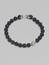A striking collection of onyx beads are laced alongside a sterling silver accent and matching closure. From the Spiritual Bead Collection 8mm onyx beads Sterling silver Bracelet length, about 8½ Sterling silver clasp Imported A striking collection of onyx beads are laced alongside a sterling silver accent and matching closure. From the Spiritual Bead Collection 8mm onyx beads Sterling silver Bracelet length, about 8½ Sterling silver clasp Imported