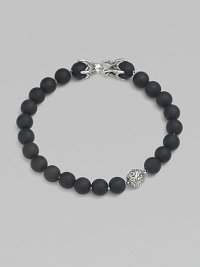 A striking collection of onyx beads are laced alongside a sterling silver accent and matching closure. From the Spiritual Bead Collection 8mm onyx beads Sterling silver Bracelet length, about 8½ Sterling silver clasp Imported 