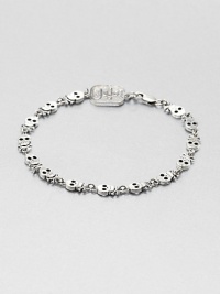Incredibly defined skulls and crossbones are neatly designed in gleaming sterling silver for a rugged, yet refined approach to masculine, motif bracelet.Sterling silverDiameter, about 3Lobster claspMade in USA Incredibly defined skulls and crossbones are neatly designed in gleaming sterling silver for a rugged, yet refined approach to masculine, motif bracelet.Sterling silverDiameter, about 3Lobster claspMade in USA