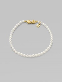 A strand of white cultured pearls with signature clasp closure.4mm white cultured pearls 18K yellow gold Length, about 7 Minuette clasp closure Imported A strand of white cultured pearls with signature clasp closure.4mm white cultured pearls 18K yellow gold Length, about 7 Minuette clasp closure Imported