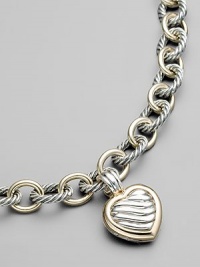 From the Carved Cable Collection. Add a romantic touch to your favorite necklace or bracelet with a cable silver heart locket, edged in 18k gold. Sterling silver and 18k yellow gold Length, about 1 Spring clip clasp Made in USA Please note: Necklace sold separately. From the Carved Cable Collection. Add a romantic touch to your favorite necklace or bracelet with a cable silver heart locket, edged in 18k gold. Sterling silver and 18k yellow gold Length, about 1 Spring clip clasp Made in USA Please note: Necklace sold separately.
