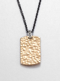 From the Palu Collection. The hand-hammered design motif of the Palu collection distinguishes a bronze dog tag pendant, connected by a sterling silver bale to a bold chain of blackened stainless steel.Bronze and sterling silverStainless steelChain length, about 24Pendant, about 2L X 1WLobster claspMade in Bali From the Palu Collection. The hand-hammered design motif of the Palu collection distinguishes a bronze dog tag pendant, connected by a sterling silver bale to a bold chain of blackened stainless steel.Bronze and sterling silverStainless steelChain length, about 24Pendant, about 2L X 1WLobster claspMade in Bali