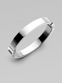 A classic design perfect on it's own or paired with more detailed pieces. Silvertone steelHinged clasp closureDiameter, about 2½Imported A classic design perfect on it's own or paired with more detailed pieces. Silvertone steelHinged clasp closureDiameter, about 2½Imported