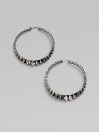 Sterling silver hoops with black rhodium accents have a faceted zigzag pattern all around. Sterling silver and black rhodium Diameter, about 2½ Pierced Imported