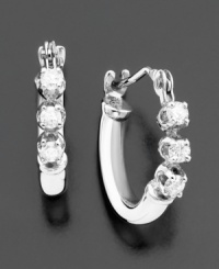 Tiny hoops add subtle sparkle to your look with glittering round-cut diamonds (1/8 ct. t.w.). Earrings set in 14k white gold. Approximate diameter: 1/4 inch. Tiny hoops add subtle sparkle to your look with glittering round-cut diamonds (1/8 ct. t.w.). Earrings set in 14k white gold. Approximate diameter: 1/4 inch.