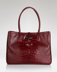 Timeless allure in practical proportions. This Longchamp shoulder bag gets it day-right in rich, croc embossed leather with distinctive details. Timeless allure in practical proportions. This Longchamp shoulder bag gets it day-right in rich, croc embossed leather with distinctive details.