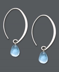 Let delicate blue hues frame your face. These subtly sweeping hoop earrings feature briolette drops of blue topaz (4 ct. t.w.) for a light splash of color. Set in 14k white gold. Approximate drop: 1-1/2 inches. Let delicate blue hues frame your face. These subtly sweeping hoop earrings feature briolette drops of blue topaz (4 ct. t.w.) for a light splash of color. Set in 14k white gold. Approximate drop: 1-1/2 inches.