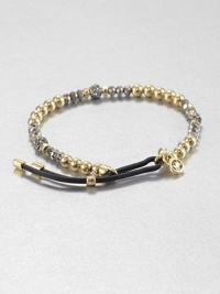 From the Brilliance Collection. A mix of silvery and golden beads includes faceted hematite, smooth gold-finished stainless steel and rhinestone-crusted spheres, strung on a stretchy strand with a leather slide close.HematiteGlassGoldtone and stainless steelLeather Diameter, about 2.25Imported From the Brilliance Collection. A mix of silvery and golden beads includes faceted hematite, smooth gold-finished stainless steel and rhinestone-crusted spheres, strung on a stretchy strand with a leather slide close.HematiteGlassGoldtone and stainless steelLeather Diameter, about 2.25Imported