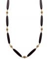 Add instant appeal to any outfit with this chic necklace from Lauren by Ralph Lauren. Featuring glass and resin onyx beads and an easy lobster claw clasp. Textured antique 14k gold plated beads provide the perfect finishing touches. Approximate length: 36 inches.
