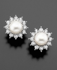 Enjoy a burst of beauty with these gorgeous earrings featuring cultured freshwater pearl (6.5-7 mm) and round-cut diamond (1/8 ct. t.w.) set in 14k white gold. Enjoy a burst of beauty with these gorgeous earrings featuring cultured freshwater pearl (6.5-7 mm) and round-cut diamond (1/8 ct. t.w.) set in 14k white gold.