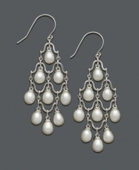 Pristine pearl drops add just the right amount of decoration. These chandelier-style earrings feature nine cultured freshwater pearls (6-6-1/2 mm) in a sophisticated sterling silver setting. Approximate drop: 2-1/4 inches. Pristine pearl drops add just the right amount of decoration. These chandelier-style earrings feature nine cultured freshwater pearls (6-6-1/2 mm) in a sophisticated sterling silver setting. Approximate drop: 2-1/4 inches.