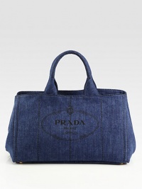 Chic denim style with heritage Prada logo print and stitch detail.Double top handles, 6 drop Open top Protective metal feet Two inside zip pockets Two inside open pockets 16W X 10H X 10D Made in Italy Chic denim style with heritage Prada logo print and stitch detail.Double top handles, 6 drop Open top Protective metal feet Two inside zip pockets Two inside open pockets 16W X 10H X 10D Made in Italy