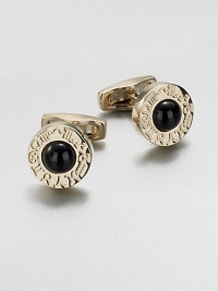 Round gold-tone cuff links with onyx center and engraved zodiac sign motif.Brass/onyxAbout ¾ diam.Made in Italy