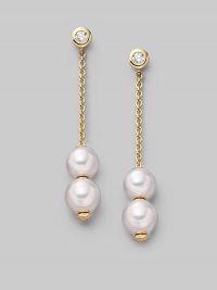 From the Pearls in Motion Collection. Delicate chains of 18k gold dangle from diamond studs and hold white Akoya pearls that slide up and down but stay where you place them. 7mm white round cultured pearls Quality: A+ Diamonds, 0.14 tcw 18k yellow gold Drop, about 1¾ Post back Imported From the Pearls in Motion Collection. Delicate chains of 18k gold dangle from diamond studs and hold white Akoya pearls that slide up and down but stay where you place them. 7mm white round cultured pearls Quality: A+ Diamonds, 0.14 tcw 18k yellow gold Drop, about 1¾ Post back Imported