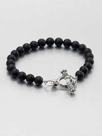 Elegant black onyx beads are joined together by logo-engraved toggle clasp of sterling silver.Sterling silverBlack onyxDiameter, about 3Width, about 8mmToggle claspMade in USA Elegant black onyx beads are joined together by logo-engraved toggle clasp of sterling silver.Sterling silverBlack onyxDiameter, about 3Width, about 8mmToggle claspMade in USA