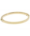Dress up your look with a simple layer. Michael Kors thin polished bangle looks great solo, but is perfect for stacking! Crafted in gold tone mixed metal. Approximate width: 1/8 inch. Approximate diameter: 2-1/4 inches.