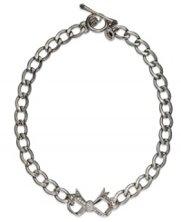 The total package. Juicy Couture's ladylike Bow Starter necklace features a glass stone-encrusted bow. Chain crafted in stainless steel. Charm and toggle crafted in silver tone brass. Approximate length: 18 inches. Approximate drop: 1 inch. The total package. Juicy Couture's ladylike Bow Starter necklace features a glass stone-encrusted bow. Chain crafted in stainless steel. Charm and toggle crafted in silver tone brass. Approximate length: 18 inches. Approximate drop: 1 inch.