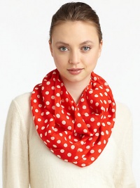 Lightweight wool is adorned with a 60's-inspired polka dot print for mod style.WoolAbout 17 X 77Dry cleanImported
