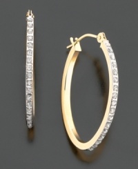 Classic elegance. Every girl must have a pair of these 14k gold diamond-accented oval-shaped hoop earrings. Approximate diameter: 1-3/4 inches.