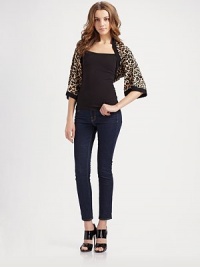 Slightly oversized jersey knit in a spotted leopard print.Three-quarter kimono sleeves About 13 from shoulder to hem 90% viscose/10% nylon; dry clean Imported Slightly oversized jersey knit in a spotted leopard print.Three-quarter kimono sleeves About 13 from shoulder to hem 90% viscose/10% nylon; dry clean Imported