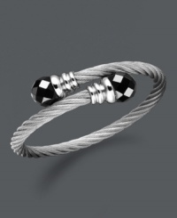 Wrap your wrists in polished perfection. This coil-shaped bangle bracelet features black onyx beads (12 mm) set in stainless steel. Approximate length: 8 inches. Wrap your wrists in polished perfection. This coil-shaped bangle bracelet features black onyx beads (12 mm) set in stainless steel. Approximate length: 8 inches.