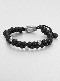 From the Spirited Bead Collection, this two-row beaded bracelet is handsomely crafted from 6mm black onyx beads, featuring three sterling silver cable beads and an adjustable clasp.Sterling silverBlack onyxAbout 9 longAbout 3 diam.Imported