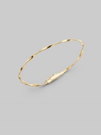 Simply stunning, this 18k gold bangle with delicate ridges and twists is great on its own, even better when stacked in multiples. 18k goldDiameter, about 2½Tongue-and-groove claspImported Please note: Bracelets sold separately. Simply stunning, this 18k gold bangle with delicate ridges and twists is great on its own, even better when stacked in multiples. 18k goldDiameter, about 2½Tongue-and-groove claspImported Please note: Bracelets sold separately.
