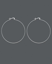 Add a dramatic touch with large hoop earrings by Unwritten. Perfect for night or day wear, these classic hoops feature a click top backing crafted in smooth sterling silver. Approximate diameter: 2-1/2 inches. Add a dramatic touch with large hoop earrings by Unwritten. Perfect for night or day wear, these classic hoops feature a click top backing crafted in smooth sterling silver. Approximate diameter: 2-1/2 inches.