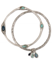 Get set up with this beautiful bangle duo from Lucky Brand. Accented by an assortment of semi-precious turquoise stones, this set will lend a look of laid-back luxe to your bracelet wardrobe. Crafted in silver tone mixed metal. Approximate diameter: 2-1/2 inches. Get set up with this beautiful bangle duo from Lucky Brand. Accented by an assortment of semi-precious turquoise stones, this set will lend a look of laid-back luxe to your bracelet wardrobe. Crafted in silver tone mixed metal. Approximate diameter: 2-1/2 inches.