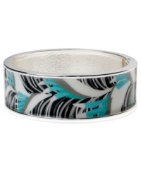 Channel the exoticism and energy of Brasil in Haskell's inspired skinny bangle. The Palm bangle features a blue and black palm leaf print design, set in silver tone mixed metal with a hinge clasp. Approximate diameter: 2-1/2 inches. Approximate length: 8 inches. Item comes packaged in a pink gift box. Channel the exoticism and energy of Brasil in Haskell's inspired skinny bangle. The Palm bangle features a blue and black palm leaf print design, set in silver tone mixed metal with a hinge clasp. Approximate diameter: 2-1/2 inches. Approximate length: 8 inches. Item comes packaged in a pink gift box.