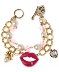 Style is what passes between these lips. This Betsey Johnson charm bracelet is crafted from antique gold-tone mixed metal with glass pearl and beaded accents. Item comes packaged in a signature Betsey Johnson Gift Box. Approximate length: 7-1/2 inches. Style is what passes between these lips. This Betsey Johnson charm bracelet is crafted from antique gold-tone mixed metal with glass pearl and beaded accents. Item comes packaged in a signature Betsey Johnson Gift Box. Approximate length: 7-1/2 inches.