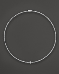 A single diamond station shines on this 18K white gold mesh necklace from Roberto Coin. A single diamond station shines on this 18K white gold mesh necklace from Roberto Coin.