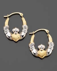 A traditional symbol of love and friendship, these beautiful claddagh hoop earrings are crafted in white & yellow 14k gold. Approximate diameter: 1/2 inch.