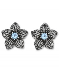 Springtime sparkle. Genevieve & Grace's delicate flower stud earrings feature a round-cut blue topaz center (1 ct. t.w.) with glittering marcasite petals. Crafted in sterling silver. Earrings feature an omega clip-on backing for non-pierced ears. Approximate diameter: 7/8 inch. Springtime sparkle. Genevieve & Grace's delicate flower stud earrings feature a round-cut blue topaz center (1 ct. t.w.) with glittering marcasite petals. Crafted in sterling silver. Earrings feature an omega clip-on backing for non-pierced ears. Approximate diameter: 7/8 inch.