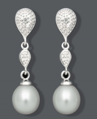 The perfect pair for the sophisticated woman. These elegant drops highlight cultured freshwater pearls (7-8 mm) and a double teardrop design accented by sparkling diamonds. Crafted in sterling silver. Approximate drop: 1 inch. The perfect pair for the sophisticated woman. These elegant drops highlight cultured freshwater pearls (7-8 mm) and a double teardrop design accented by sparkling diamonds. Crafted in sterling silver. Approximate drop: 1 inch.