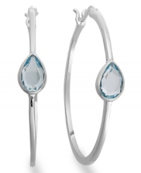Traditional hoops with a sparkling pop of color. Victoria Townsend's glam style features pear-cut blue topaz (2-1/5 ct. t.w.) in a shining sterling silver setting. Approximate diameter: 1-1/2 inches. Traditional hoops with a sparkling pop of color. Victoria Townsend's glam style features pear-cut blue topaz (2-1/5 ct. t.w.) in a shining sterling silver setting. Approximate diameter: 1-1/2 inches.