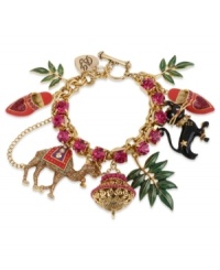 Tropical chic. This Betsey Johnson charm bracelet features a gold tone mixed metal chain with fuchsia-colored crystal cup chain accent, gold tone glitter camel, black cat with gold tone details, gold tone and purple lamp, green leaves and Moroccan style pink shoes. Approximate length: 7-1/2 inches. Tropical chic. This Betsey Johnson charm bracelet features a gold tone mixed metal chain with fuchsia-colored crystal cup chain accent, gold tone glitter camel, black cat with gold tone details, gold tone and purple lamp, green leaves and Moroccan style pink shoes. Approximate length: 7-1/2 inches.