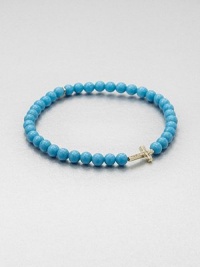 From the Devout Collection. A colorful, turquoise beaded bracelet embellished with a diamond accented 14k gold cross. Turquoise14k goldDiamonds, .06 tcwLength, about 6.5Slip-on styleImported From the Devout Collection. A colorful, turquoise beaded bracelet embellished with a diamond accented 14k gold cross. Turquoise14k goldDiamonds, .06 tcwLength, about 6.5Slip-on styleImported