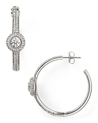 Pave-set crystals and a delicate shape elevate these classic rhodium-plated hoop earrings from Nadri from ordinary to opulent. Pave-set crystals and a delicate shape elevate these classic rhodium-plated hoop earrings from Nadri from ordinary to opulent.