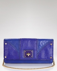 Milly makes an exotic statement with this iguana-embossed clutch. It's handheld silhouette is wholly classic, while textured leather adds an on-trend edge. Milly makes an exotic statement with this iguana-embossed clutch. It's handheld silhouette is wholly classic, while textured leather adds an on-trend edge.