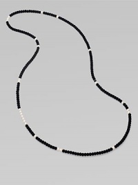 From the Night Blue Collection. This high contrast piece features a long strand of flocked velvet beads punctuated by pearlized glass beads. Length, about 49½ Slip-on style Imported From the Night Blue Collection. This high contrast piece features a long strand of flocked velvet beads punctuated by pearlized glass beads. Length, about 49½ Slip-on style Imported