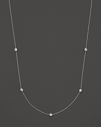A white gold necklace with five bezel-set diamond stations; with signature ruby accent. Designed by Roberto Coin. A white gold necklace with five bezel-set diamond stations; with signature ruby accent. Designed by Roberto Coin.