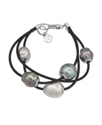 When modest tradition and modern edge combine. This chic, new style by Majorica features three rows of black leather cord strung with multicolored, organic, man-made pearls (12 mm). Setting and clasp crafted in sterling silver. Approximate length: 7-1/2 inches. When modest tradition and modern edge combine. This chic, new style by Majorica features three rows of black leather cord strung with multicolored, organic, man-made pearls (12 mm). Setting and clasp crafted in sterling silver. Approximate length: 7-1/2 inches.